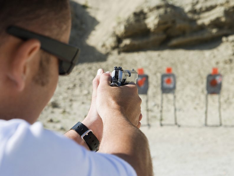 Man Aiming The Target With Handgun